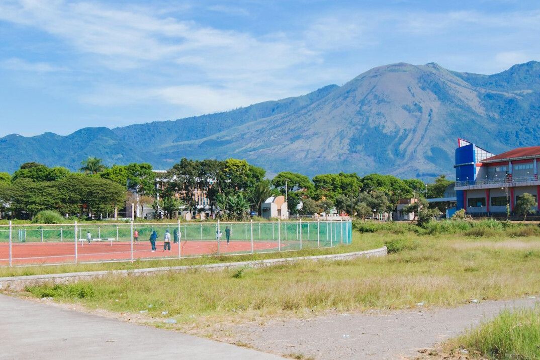 Athlete running on a stadium track